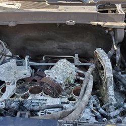 Peak Autosports, LLC - Engine compartment 2 years after trying to get my money back. What's left of the engine is in the back seat in boxes.