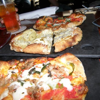 Serious Pie Downtown - Pie For Five - Cherry Bomb Peppers /  Sweet Fennel Sasuage, Yukon Gold Potato & Buffalo Mozzarella / San Marzano Tomato pizzas - Pizza Near Me - Seattle, Washington