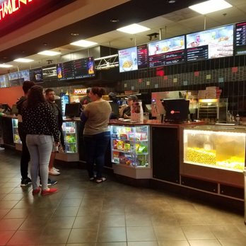 AMC West Melbourne 12 - This is the main desk where tickets and food are sold. Don't forget that the food is pricier here because it is more "fancy." - Cinema Near Me - West Melbourne, Florida