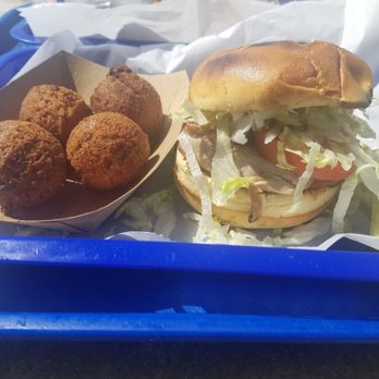 Killer Seafood - Tuna burger (bland. Schaap shredded iceberg lettuce and flavorless tomato slice) with hush puppies (that were actually pretty good). - Seafood Near Me - Mexico Beach, Florida