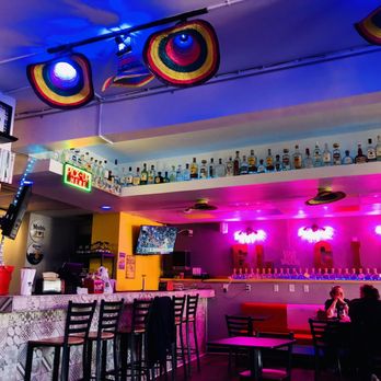 El Cid - a brightly lit bar with neon lights - Mexican Near Me - Lexington, Kentucky