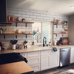 Old Town Handyman Services - Subway tile backsplash with rustic wood shelving.