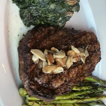 Ricardo Steak House - Boneless Rib Eye with garlic spinach and Asparagus Parmesan - Steakhouses Near Me - New York, New York Ricardo Steak House - Boneless Rib Eye with garlic spinach and Asparagus Parmesan - Steakhouses Near Me - New York, New York