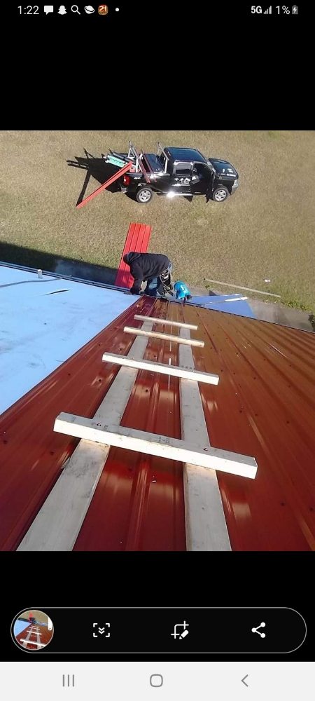 Slide of Travie T's Roofing Firm