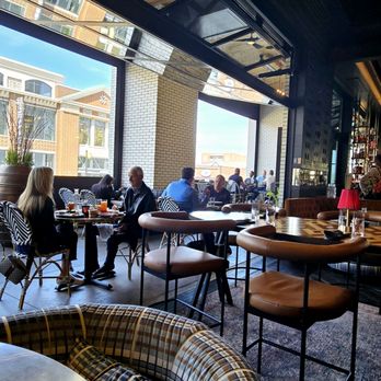 1933 Lounge - Overhead garage doors were open to patio - Cocktail Bars Near Me - Carmel, Indiana
