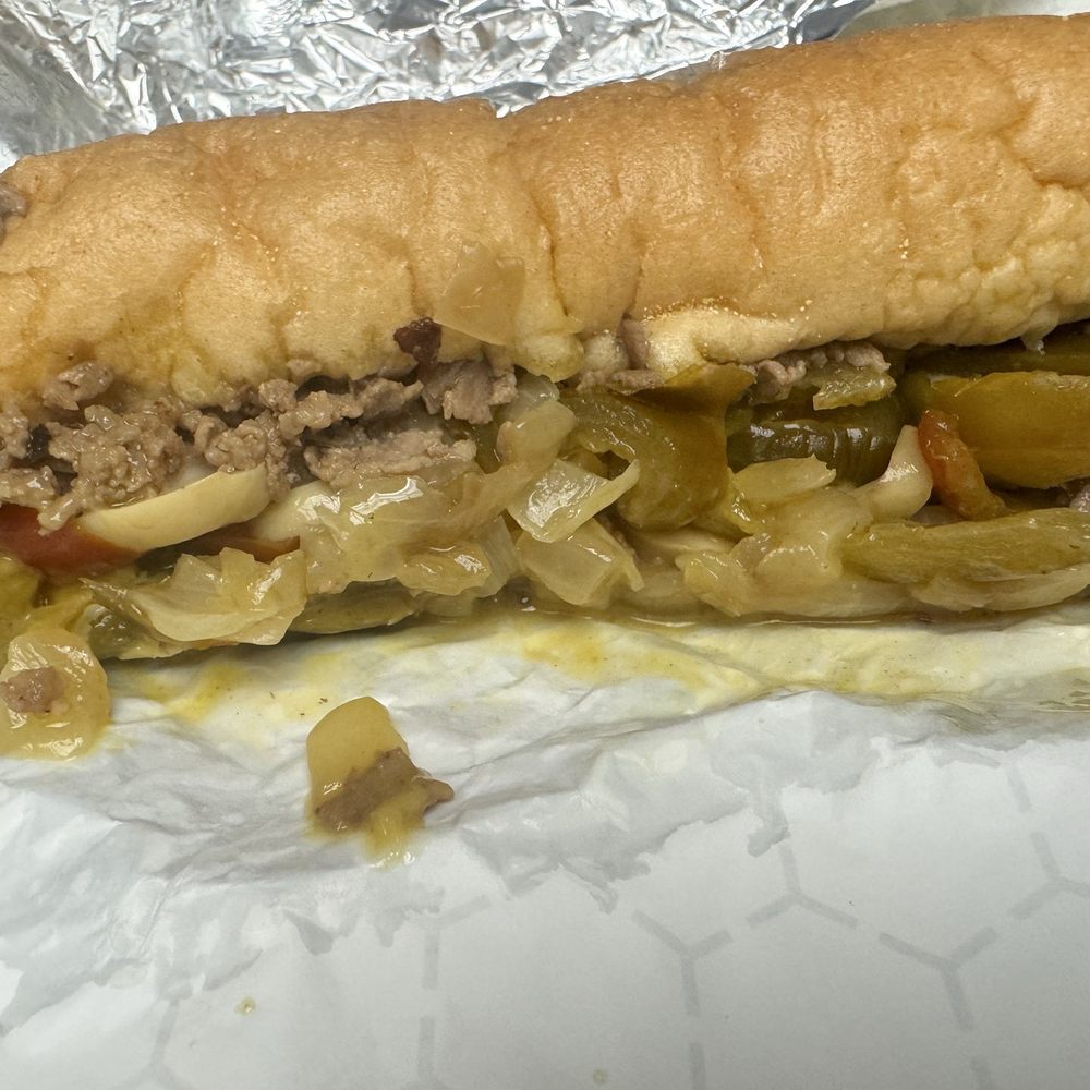 Phillys best cheesesteak with onions mushrooms and peppers, provolone and wiz