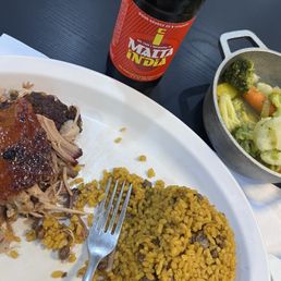 Pernil, arroz con gandules, steamed vegetables, malta Pernil, arroz con gandules, steamed vegetables, malta