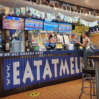 Melba's - a woman standing at the counter - Chicken Wings Near Me - New Orleans, Louisiana