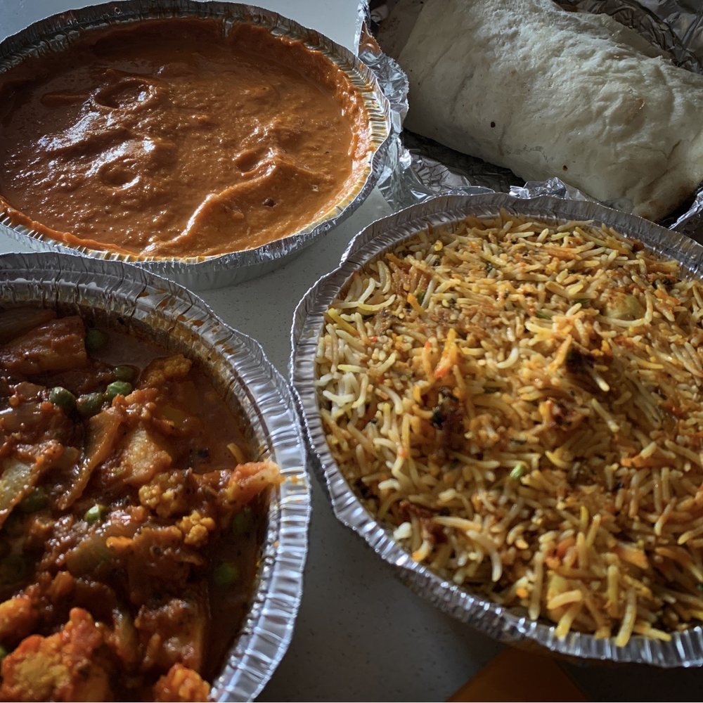 Zeera By The Bay - Clockwise from bottom left: Aloo Gobi, Paneer Korma, Bread Basket and Chicken Biryani. - Indian Near Me - Pickering, Ontario Zeera By The Bay - Clockwise from bottom left: Aloo Gobi, Paneer Korma, Bread Basket and Chicken Biryani. - Indian Near Me - Pickering, Ontario
