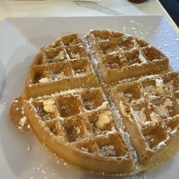 The Poked Yolk - Belgium waffle with powdered sugar - Diners Near Me - Buffalo, New York The Poked Yolk - Belgium waffle with powdered sugar - Diners Near Me - Buffalo, New York