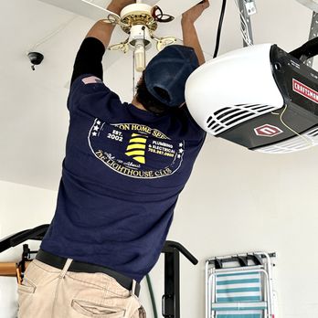 Beacon Home Services - One of our professional electricians installing a new ceiling fan. - Electricians Near Me - Manassas, Virginia Beacon Home Services - One of our professional electricians installing a new ceiling fan. - Electricians Near Me - Manassas, Virginia