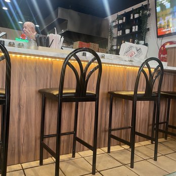Tony's Pizza and DraftHouse - a row of bar stools - Pizza Near Me - Miami Gardens, Florida Tony's Pizza and DraftHouse - a row of bar stools - Pizza Near Me - Miami Gardens, Florida