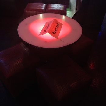 Mezcal Lounge - a table with a red light on it - Mexican Near Me - Fresno, California