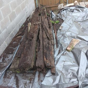 Hired Hand Junk Services - Railroad ties on the tarp waiting to be picked up and legally disposed. - Junk Removal & Hauling Near Me - Hammond, Indiana Hired Hand Junk Services - Railroad ties on the tarp waiting to be picked up and legally disposed. - Junk Removal & Hauling Near Me - Hammond, Indiana