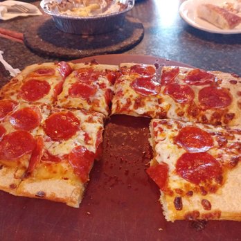 Pizza Hut - a pepperoni pizza cut into slices - Pizza Near Me - Charleston, West Virginia Pizza Hut - a pepperoni pizza cut into slices - Pizza Near Me - Charleston, West Virginia