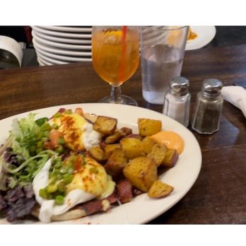 Cafe Bonjour - Eggs Benedict with bacon -- tasted like turkey bacon almost-- but very good. Aperol spritz (small glass, $12) - Breakfast & Brunch Near Me - Boston, Massachusetts Cafe Bonjour - Eggs Benedict with bacon -- tasted like turkey bacon almost-- but very good. Aperol spritz (small glass, $12) - Breakfast & Brunch Near Me - Boston, Massachusetts
