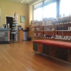Sakora Salon and Day Spa - Waiting area with many Aveda products for sale.
