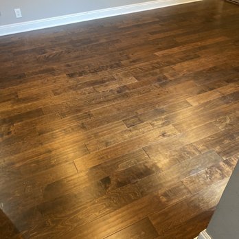 Pacifica Hardwood Floors - a hardwood floor in a living room - Flooring Near Me