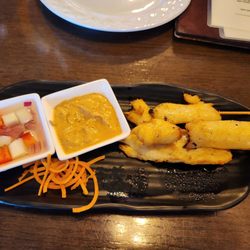 Thai Peppers Haymarket - Our appetizer Sa Tay. Delicious and the cucumber salad was addicting.