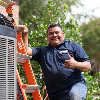 Middleton Heat & Air - Middleton HVAC technician performing service on an external air conditioning unit - Heating & Air Conditioning/HVAC Near Me - Bryant, Arkansas Middleton Heat & Air - Middleton HVAC technician performing service on an external air conditioning unit - Heating & Air Conditioning/HVAC Near Me - Bryant, Arkansas