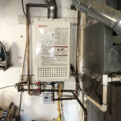 American Plumbing Service - Previous tankless water heater.