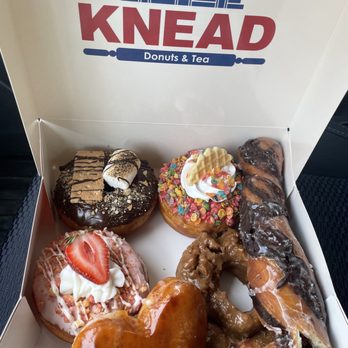 Knead Donuts - S'more, Fruit Pebble, Tiger Tail, salted carmel, and creme brulee (heart-shaped). - Donuts Near Me - Cerritos, California Knead Donuts - S'more, Fruit Pebble, Tiger Tail, salted carmel, and creme brulee (heart-shaped). - Donuts Near Me - Cerritos, California