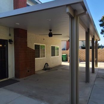 Bravo Patio Covers - Solid patio cover, insulated, Adobe color with white ceiling. We added 6 lights, 2 fans, and 1 extra electrical outlet. - Patio Coverings Near Me