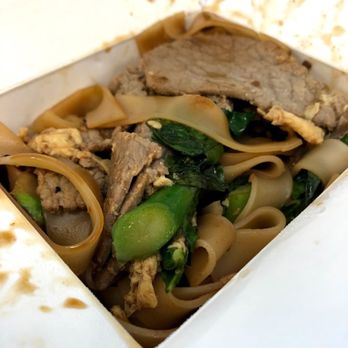 Thai Express - an open takeout box with noodles and meat - Thai Near Me - Dallas, Texas Thai Express - an open takeout box with noodles and meat - Thai Near Me - Dallas, Texas