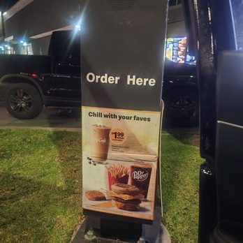 McDonald's - This is the advertisement for the ice coffee at the drive thru entrance. - Fast Food Near Me - Los Angeles, California McDonald's - This is the advertisement for the ice coffee at the drive thru entrance. - Fast Food Near Me - Los Angeles, California