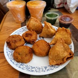 Samosas, aloo tikki and mango lassi Samosas, aloo tikki and mango lassi