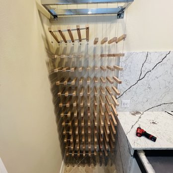 Sand Dollar Energy - a wine rack in a bathroom - Handyman Near Me Sand Dollar Energy - a wine rack in a bathroom - Handyman Near Me