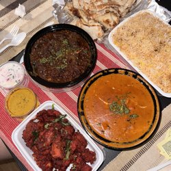Chicken 65 (Dry), Karaikudi Goat Curry, Butter Chicken, and Chicken Tikka Biryani with garlic naan