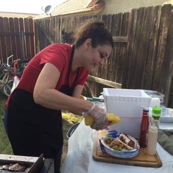 Tacos N Tunes - Can't forget the bacon dogs !!! Chef Sheerah hooking up the special toppings! - Caterers Near Me Tacos N Tunes - Can't forget the bacon dogs !!! Chef Sheerah hooking up the special toppings! - Caterers Near Me