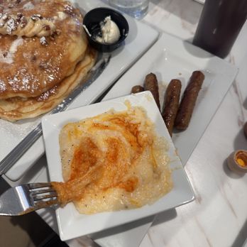 Keke's Breakfast Cafe - Cheddar grits with hot sauce - Breakfast & Brunch Near Me - Orlando, Florida Keke's Breakfast Cafe - Cheddar grits with hot sauce - Breakfast & Brunch Near Me - Orlando, Florida