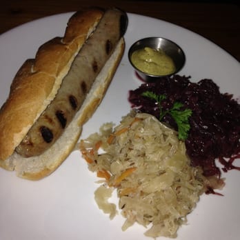 Reichenbach Hall - Bratwurst Sandwich - pork sausage on pretzel bun with mustard, sweet & sour red cabbage, sauerkraut - Bars Near Me - New York, New York Reichenbach Hall - Bratwurst Sandwich - pork sausage on pretzel bun with mustard, sweet & sour red cabbage, sauerkraut - Bars Near Me - New York, New York