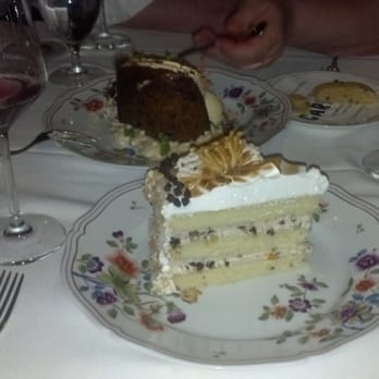 Carbone - Carrot cake (background) and chocolate chip cannoli meringue cake (foreground) w/ comped grappa & limoncello - Italian Near Me - New York, New York