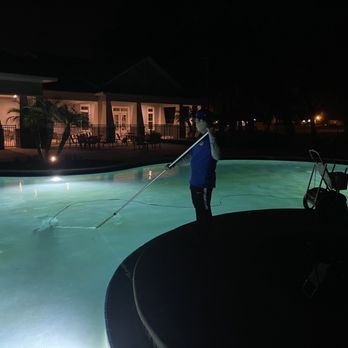 Puddle Pool Services - One of our customer's beautiful pool at night. - Pool Cleaners Near Me - The Villages, Florida