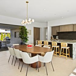 Elfia Design Studio - Stylish dining space and designer kitchen setup for luxury staging in Southern California. Perfectly balanced lighting and layout