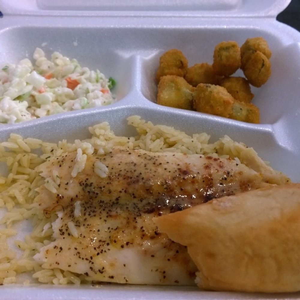 Lemon Pepper White Fish Meal.  About 7 bucks, comes with rice.  Left corner is their coleslaw and right corner is fried okra.