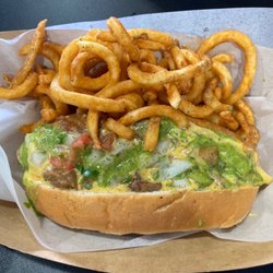 The Dogfather II - Gotta Guisada - Beef Frank, Guisada, Queso,Pico de Gallo and Salsa Verde... Curly Fry side.