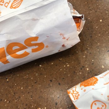 Popeyes Louisiana Kitchen - a closeup of a bag of fries - Fast Food Near Me - Pace, Florida