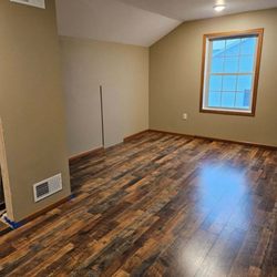 Tip-Top Roofing Solutions - New flooring installation with drywall and paint by Tip-Top Roofing Solutions LLC.
