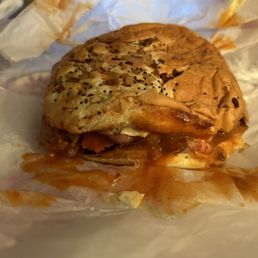 Super roast beef on an onion roll with sauce and american chesse