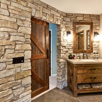 Ammirato Construction - a bathroom with a stone wall - General Contractors Near Me - Campbell, California Ammirato Construction - a bathroom with a stone wall - General Contractors Near Me - Campbell, California