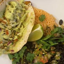 Shrimp and salmon tacos with curry black beans and rice