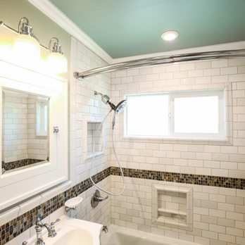 Merit Construction - Over view of new bathroom remodel paint, subway tile walls in three white tones, with tile framed window and soap dishes - General Contractors Near Me - San Diego, California Merit Construction - Over view of new bathroom remodel paint, subway tile walls in three white tones, with tile framed window and soap dishes - General Contractors Near Me - San Diego, California