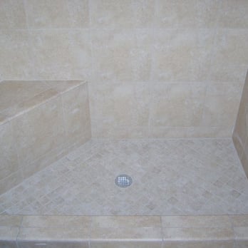 Lodi Tile Works - a shower with a drain - Flooring Near Me - Lodi, California