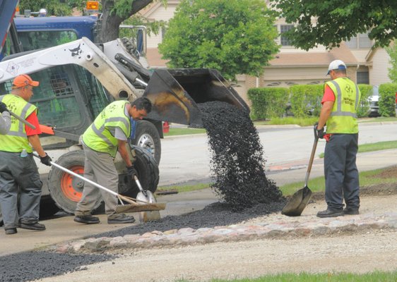 Asphalt paving in progress — NW Suburbs