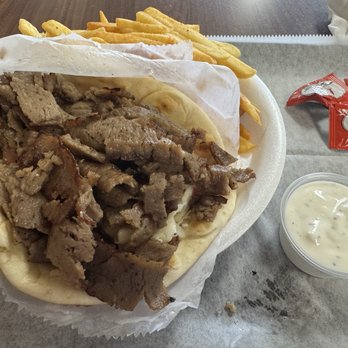 Maro's Gyros - Gyro Wrap with fries and Tzatziki sauce. Toppings on the bottom! - Mediterranean Near Me - Smyrna, Tennessee
