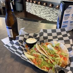 Oasis Pub - Fish Tacos with a cold bottle of beer